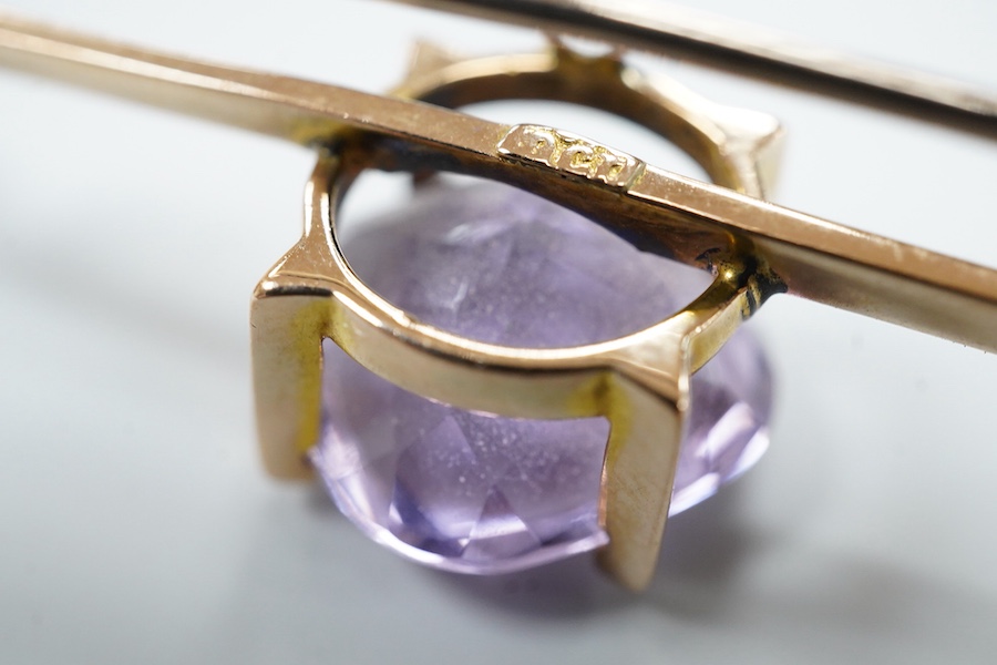 A cased late Victorian 9ct and single stone amethyst set bar brooch, 45mm, a cased yellow metal and single stone white opal set stick pin and a modern 18ct white gold, ruby and diamond cluster ring, size L/M.